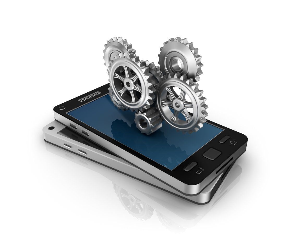 A cell phone with gears coming out of it